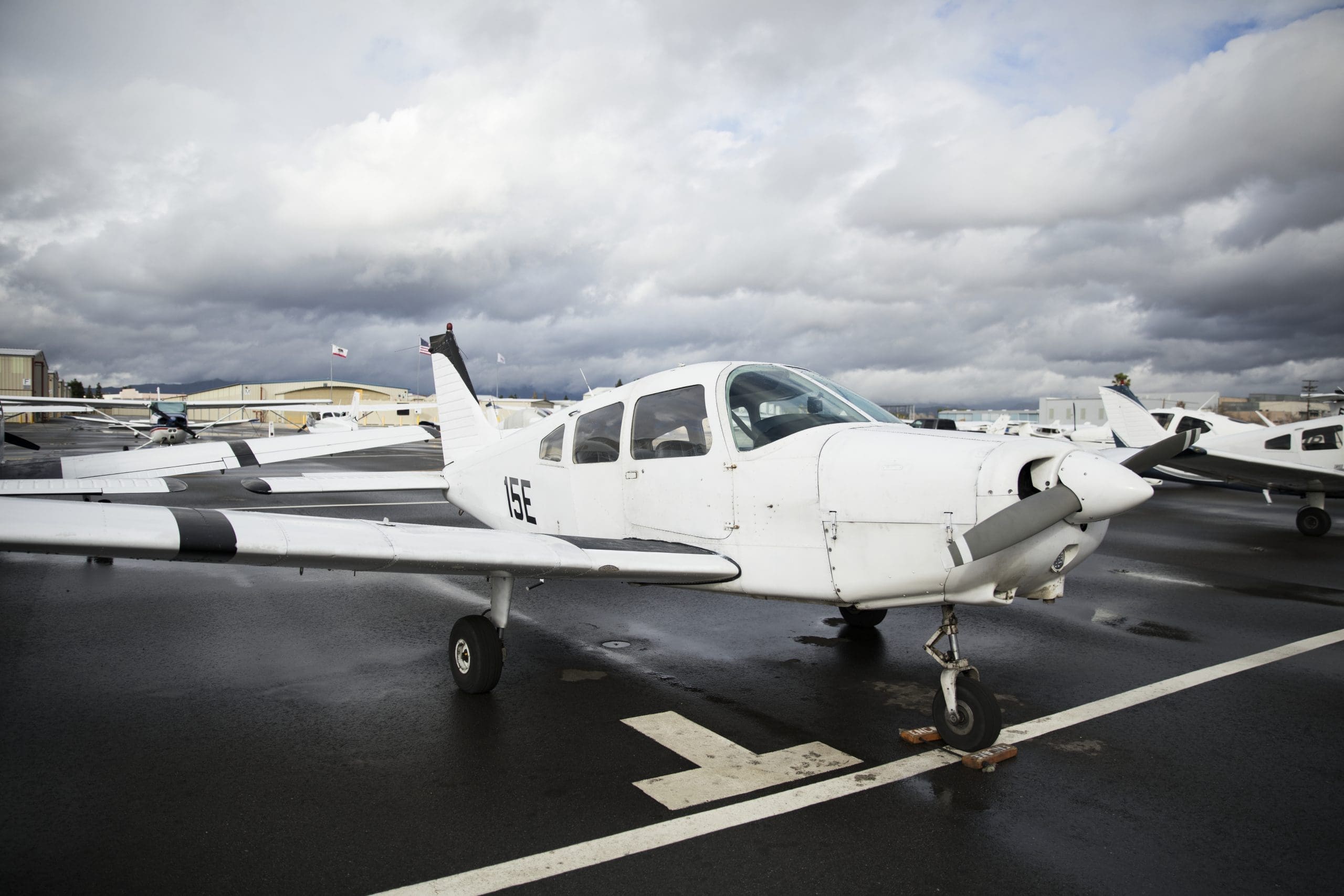 Front propellor plane parked at an airport